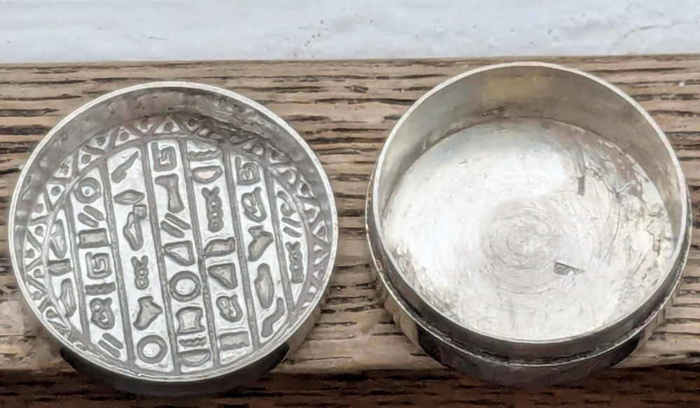 Small and sturdy Egyptian silver pill box with hieroglyphics: 2.9cm diameter