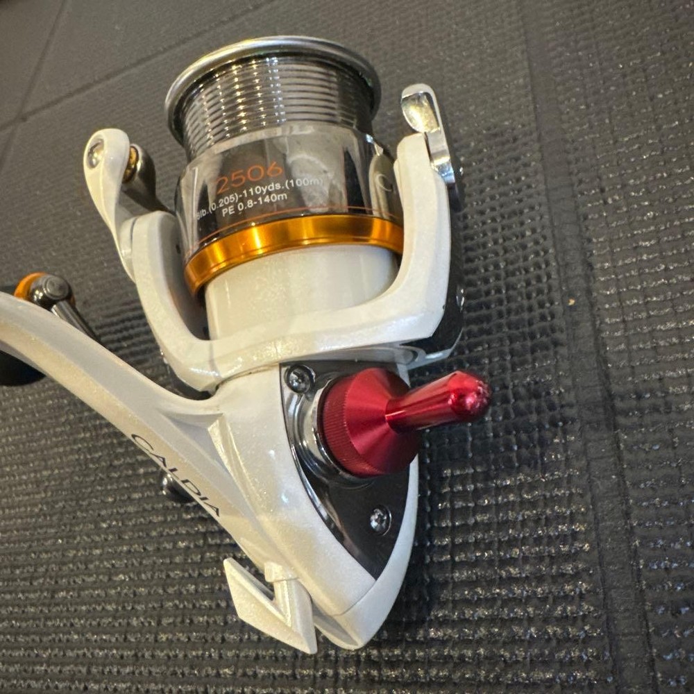 CALDIA spinning reel white/orange with bonus