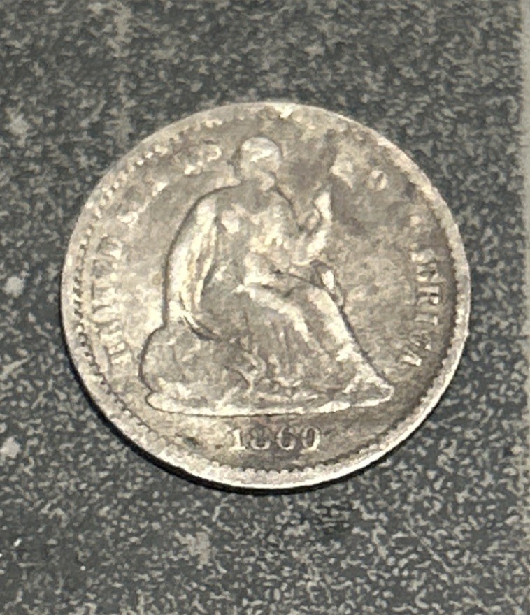 1860 Liberty Seated Silver Half Dime.