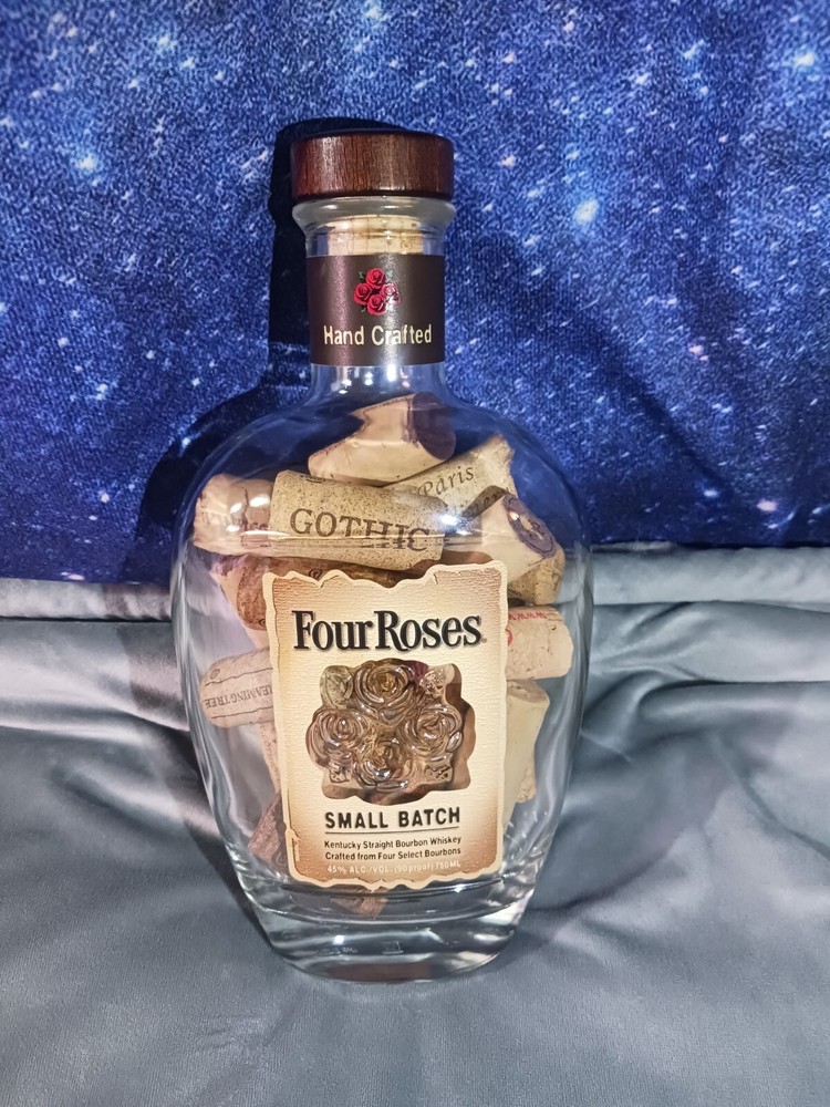 Cork Bottle, a glass Four Roses bottle filled with wine corks