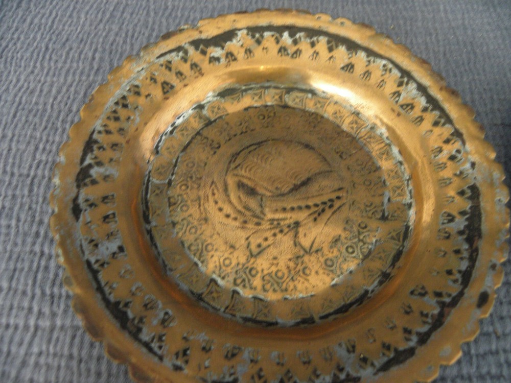 Pair of copper Middle Eastern dishes, both signed