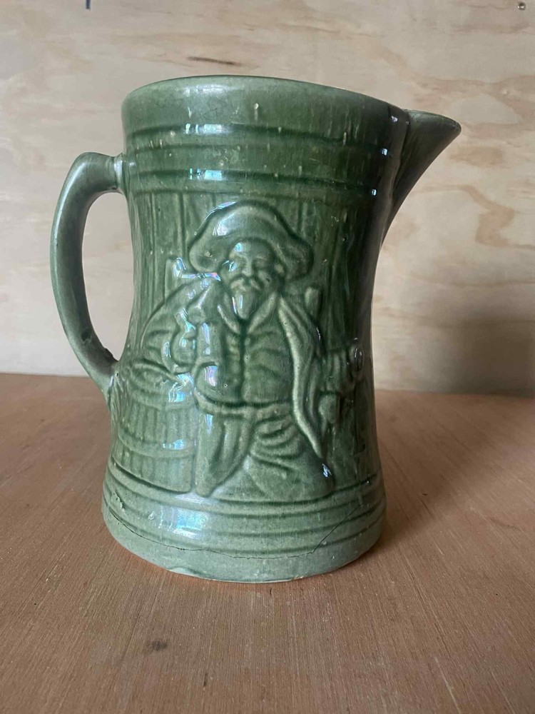 Green Ceramic Pitcher with Handle, Embossed Decorative Design, Glossy Round