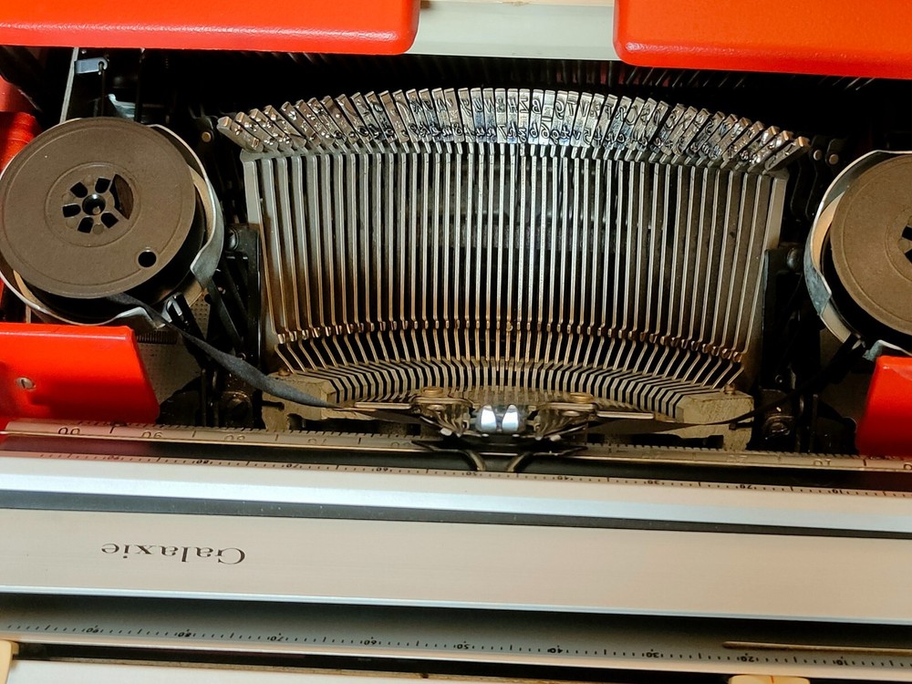 red, portable Smith Corona Galaxie typewriter with Cursive / Handwritten Script