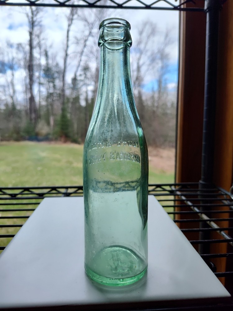 Vintage Pluto Water Bottle America’s Physic Devil Embossed Green