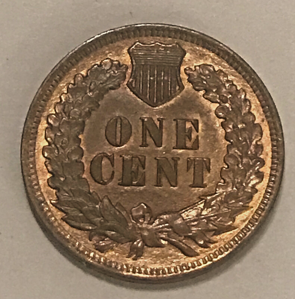 1904 Indian cent , uncirculated, mostly brown, some red remains