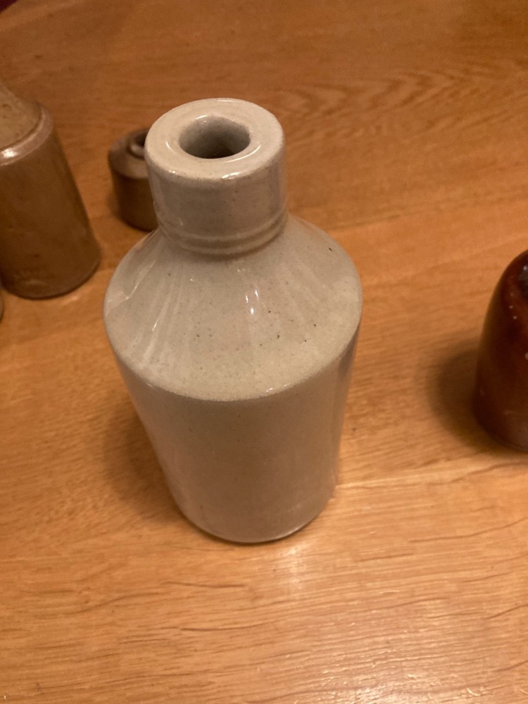 Vintage stone bottle collection in decent condition.