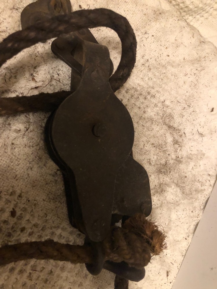 Antique primitive rope and chain hoist