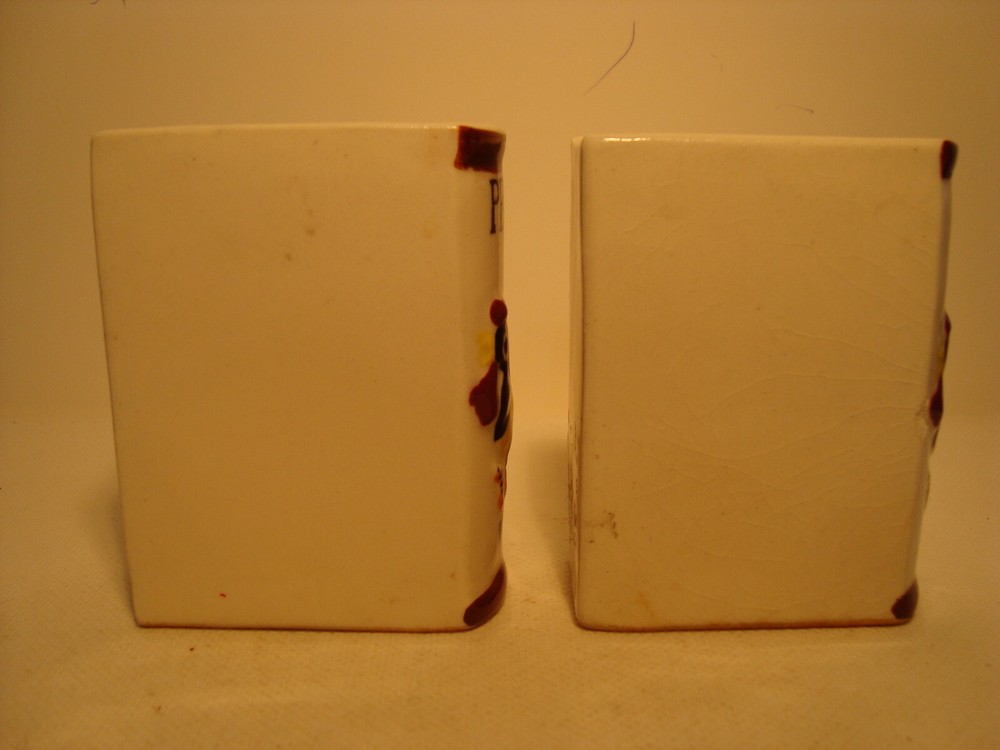White porcelain book shape salt & pepper shaker set.