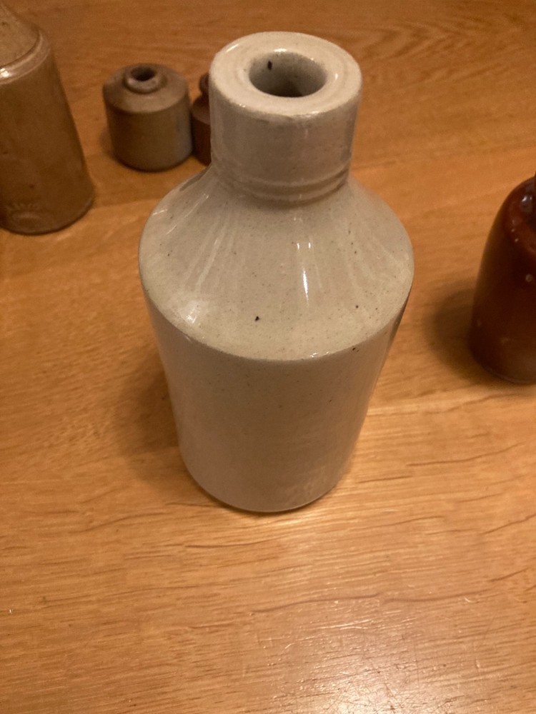 Vintage stone bottle collection in decent condition.