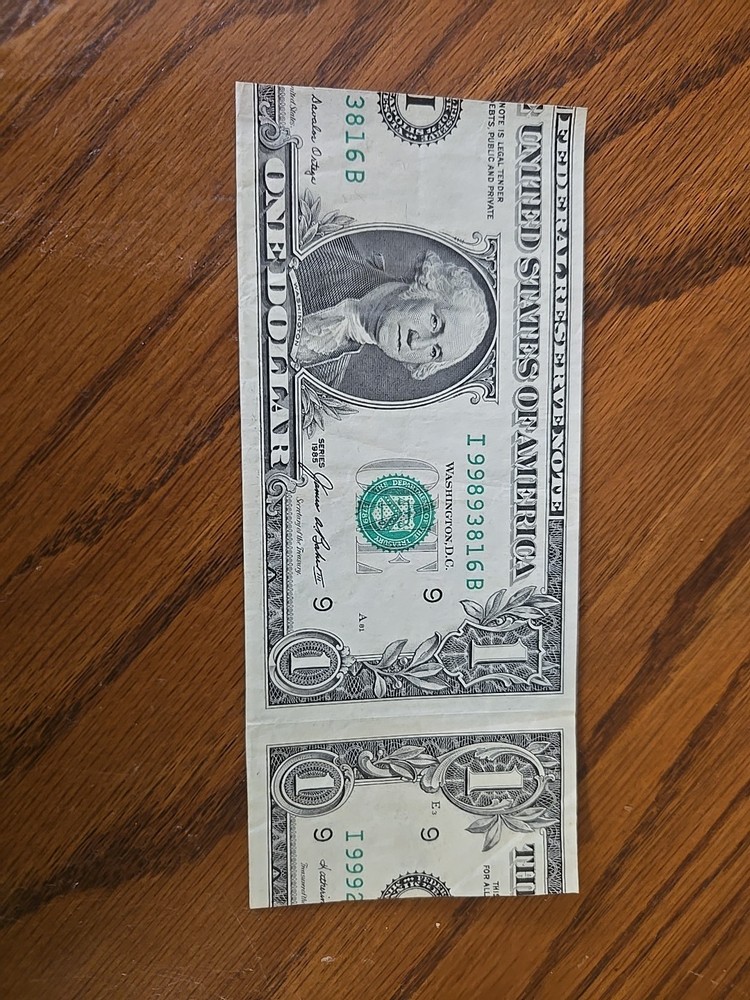 Miscut one crisp dollar bill 1985.