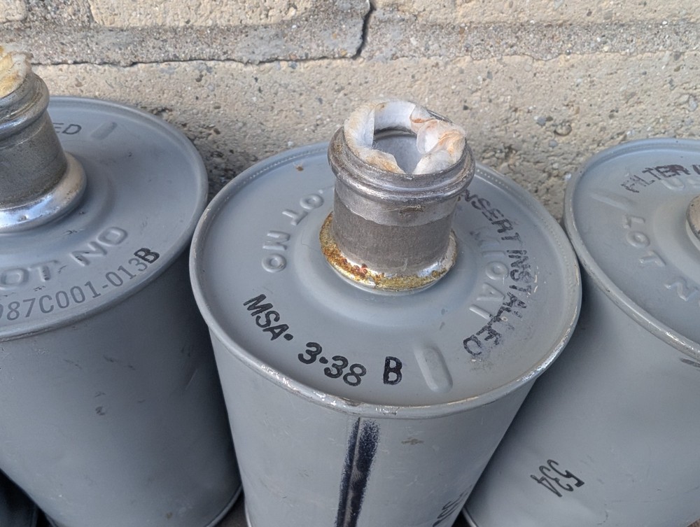 US M10A1 Gas Mask Filter - Used, Dented