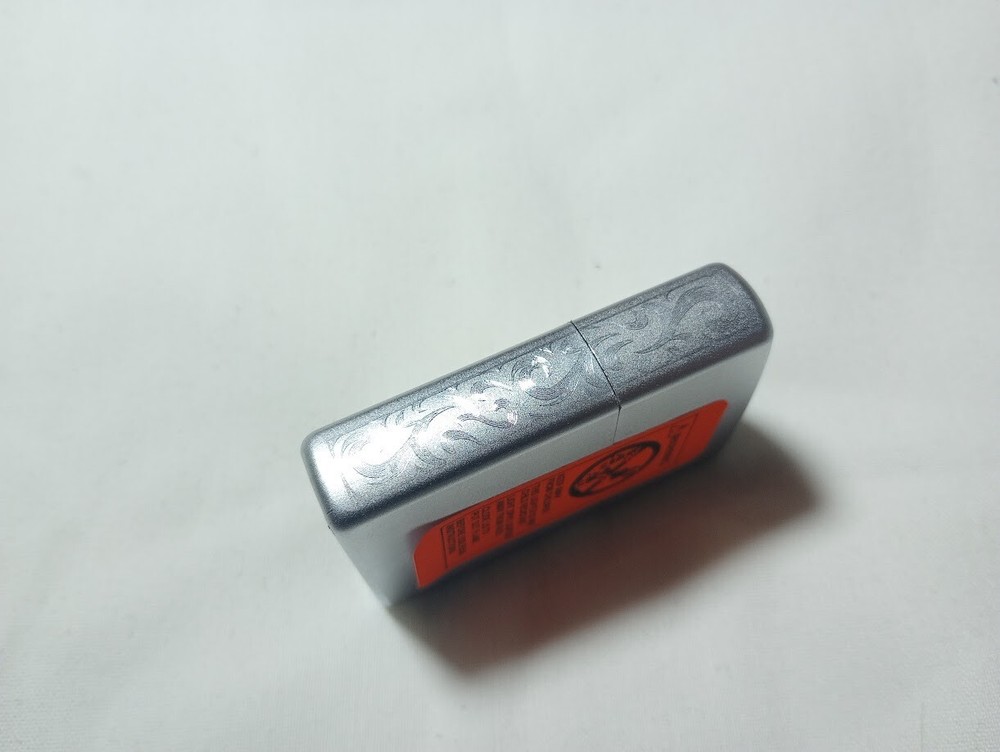 ---New unfired 2005 Zippo DWM monogram engraved lighter