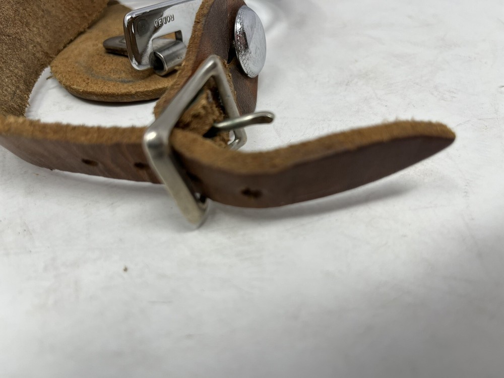 Silver Rodeo Spurs with Leather Straps and Rowels