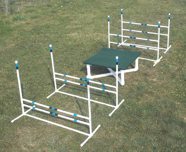 dog agility training starter kit with 4 jumps and table