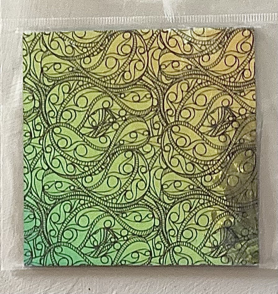 Dichroic Glass 4” On Thin Black Etched Twisted Tracks Pattern