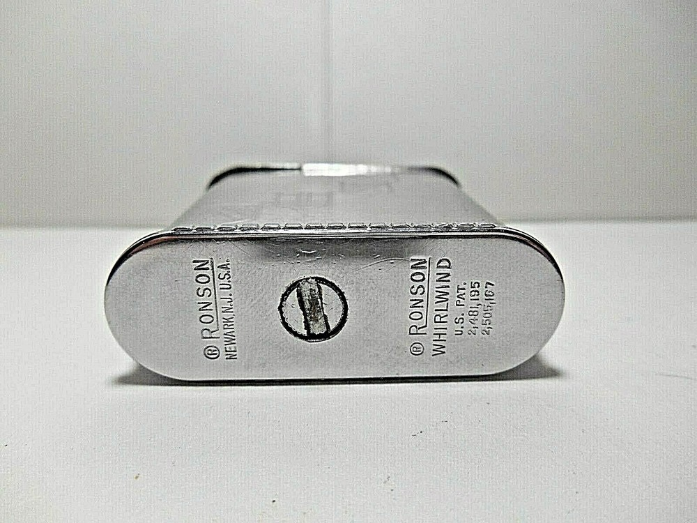 Vintage Ronson WHIRLWIND CHROME CIGARETTE LIGHTER. ETCHED 14TH CENTURY SHIELDS