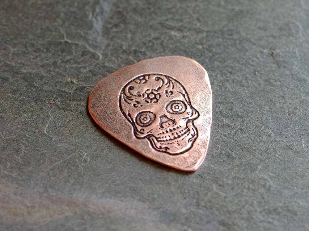 playable copper guitar pick with sugar skull - NicisPicks Original