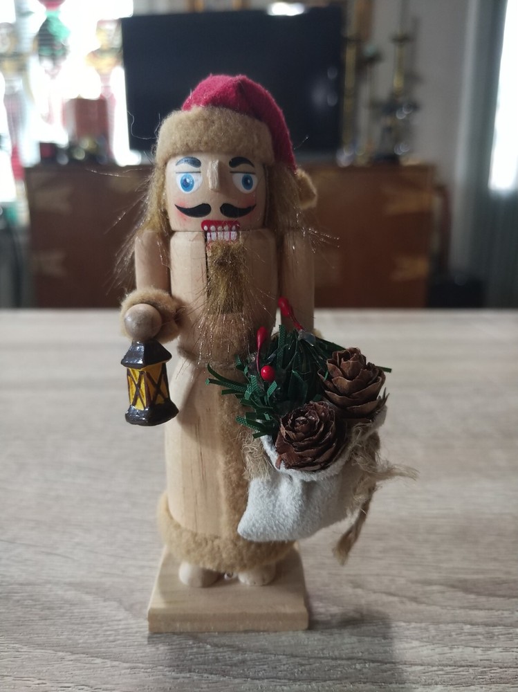 Handcrafted, painted wood Christmas nutcracker ornament