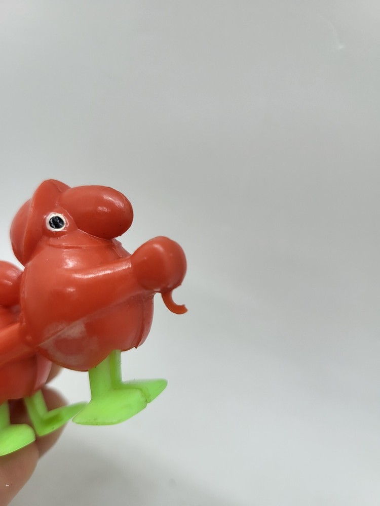 Vintage Minature Red Plastic Goon Walking