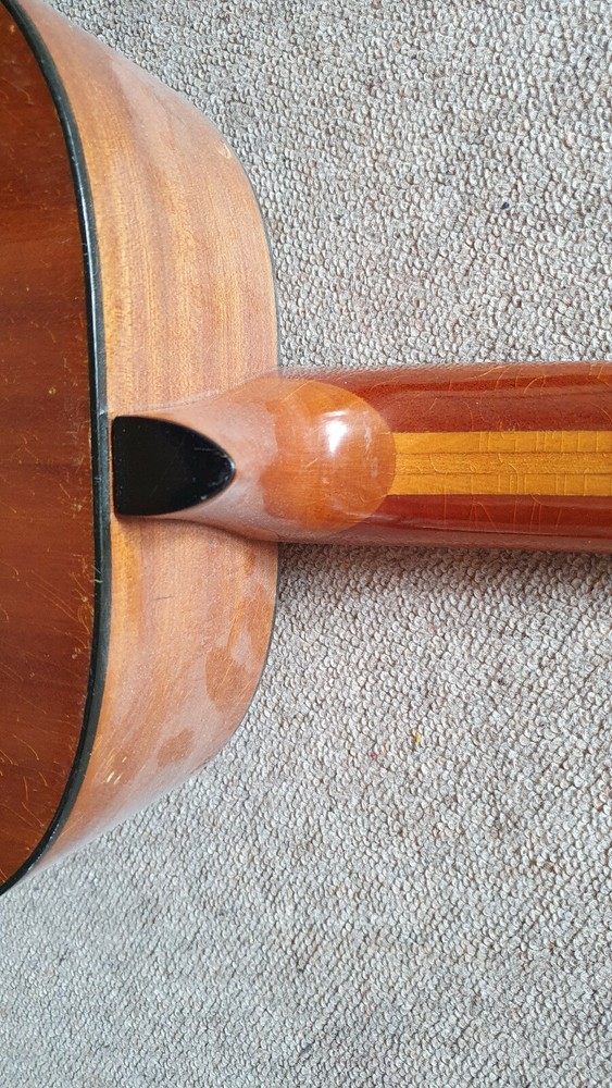 Old guitar with a nicely flamed back, needs service