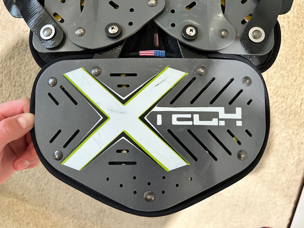 XTECH Medium shoulder pads (Football) comes with size small backplate.