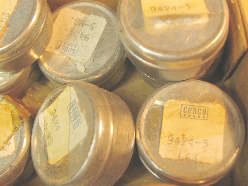 Collection of tiny marked weights 5mg-500mg.