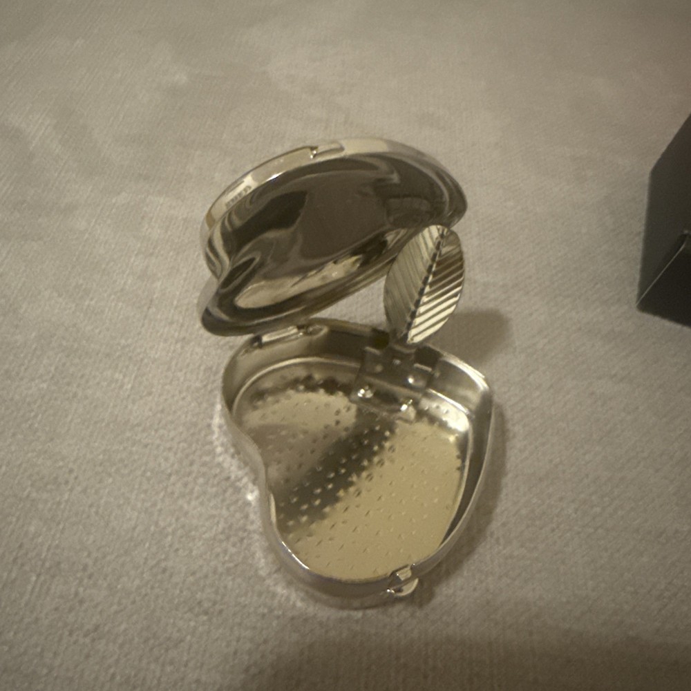 silver color pill box heart shape with leaf