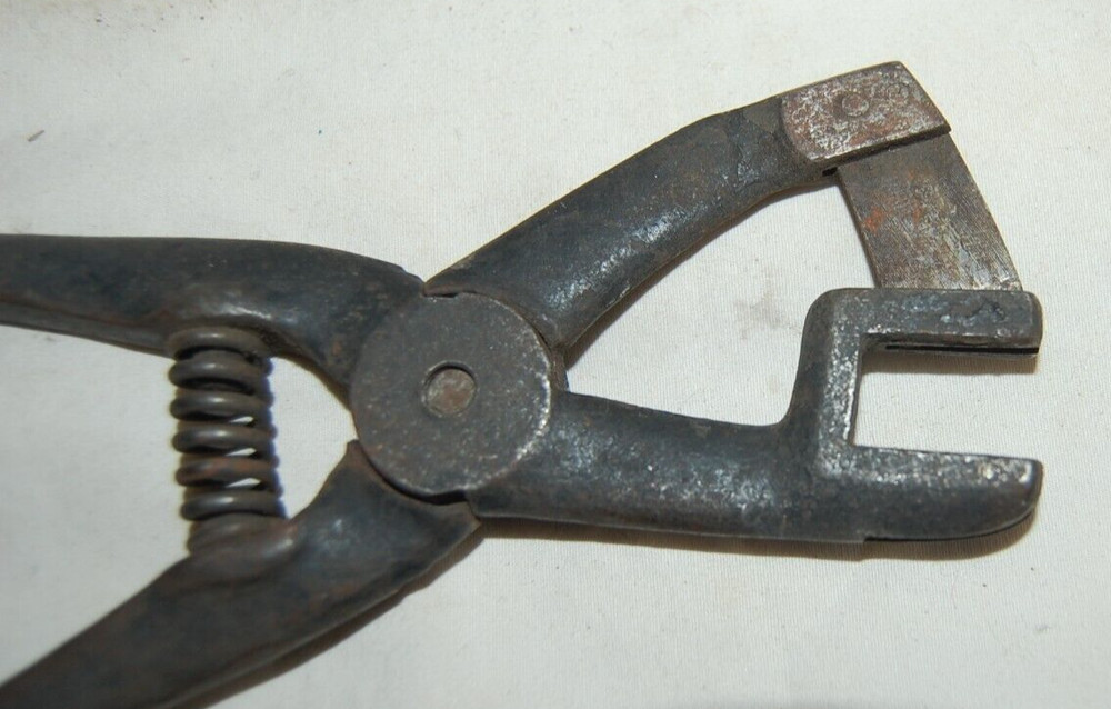 Unusal Antique Spring Loaded Iron Crimper ?