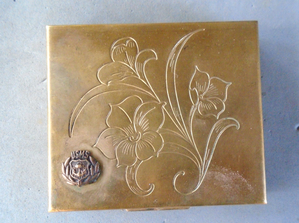 vintage compact with Merchant Marine pin on front