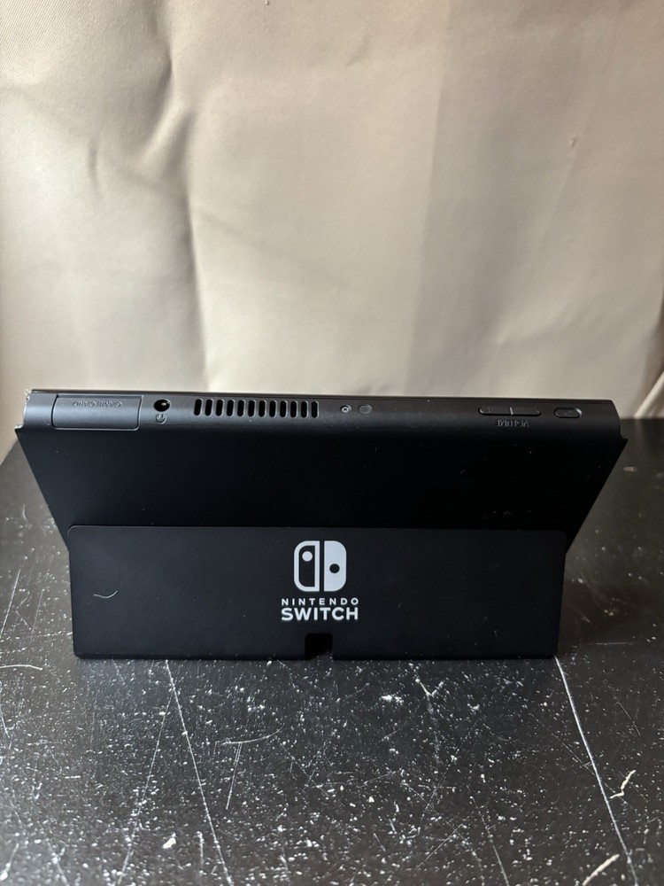 Nintendo Switch OLED Bundle with Joy-Con Controllers, Controller Grip, FC26 Game