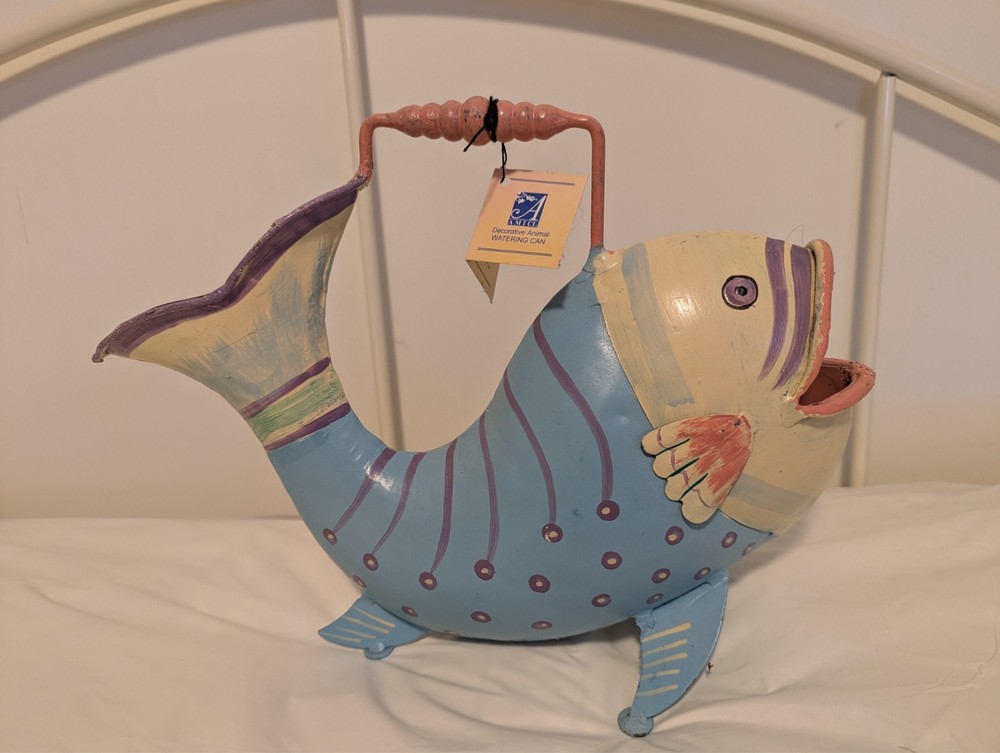 Decorative, hand painted fish watering can
