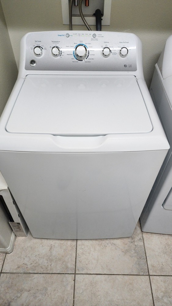 Immaculate washer and dryer set side by side matching white color