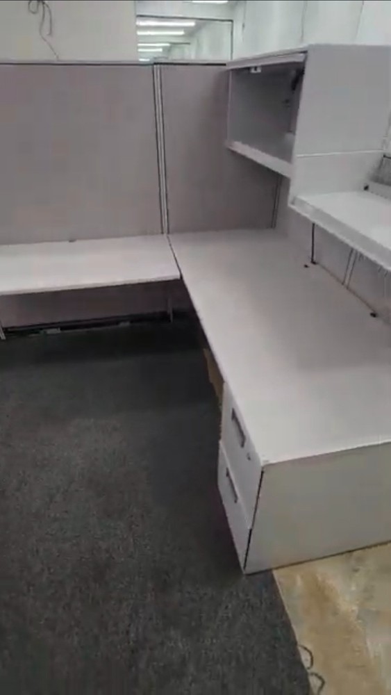 Eight used office cubicles and office desk.