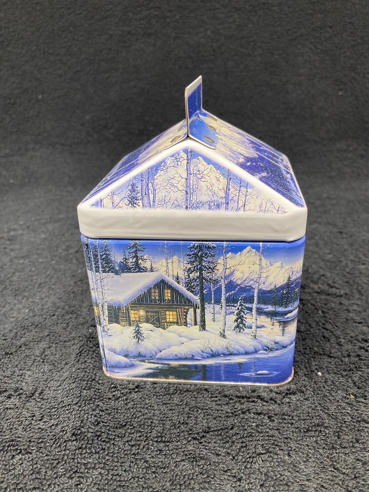 Winter mountain cabin scene tin