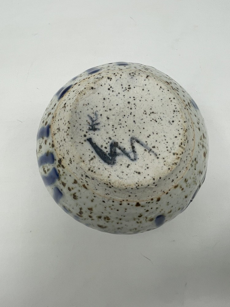 Pottery vase blue with brown specs .