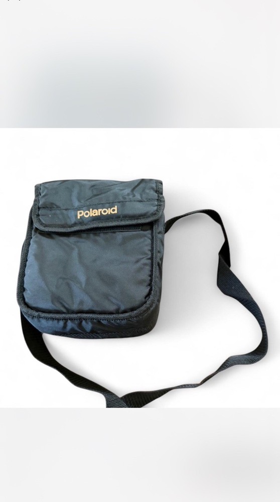 Vintage Polaroid 600 black camera with strap