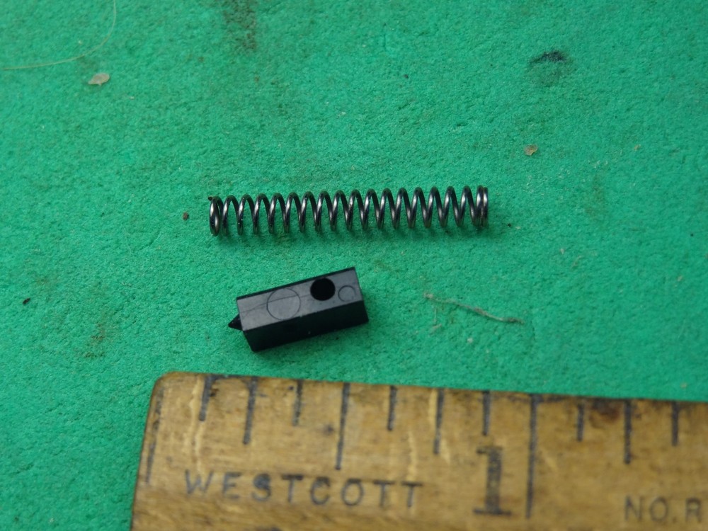 Winchester 1400 Carrier Release Retainer (plastic) w/ Spring