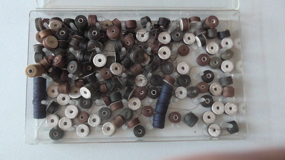 vintage sewing machine bobbins, many thread colors, several dozen