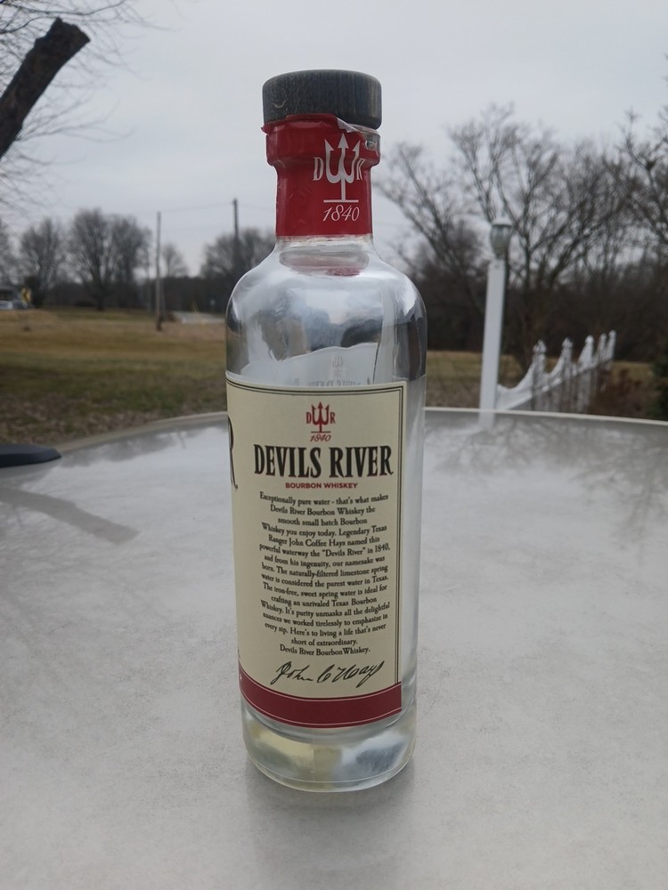 Empty Corked Bottle Of Devil's River Barrel Bourbon Whiskey