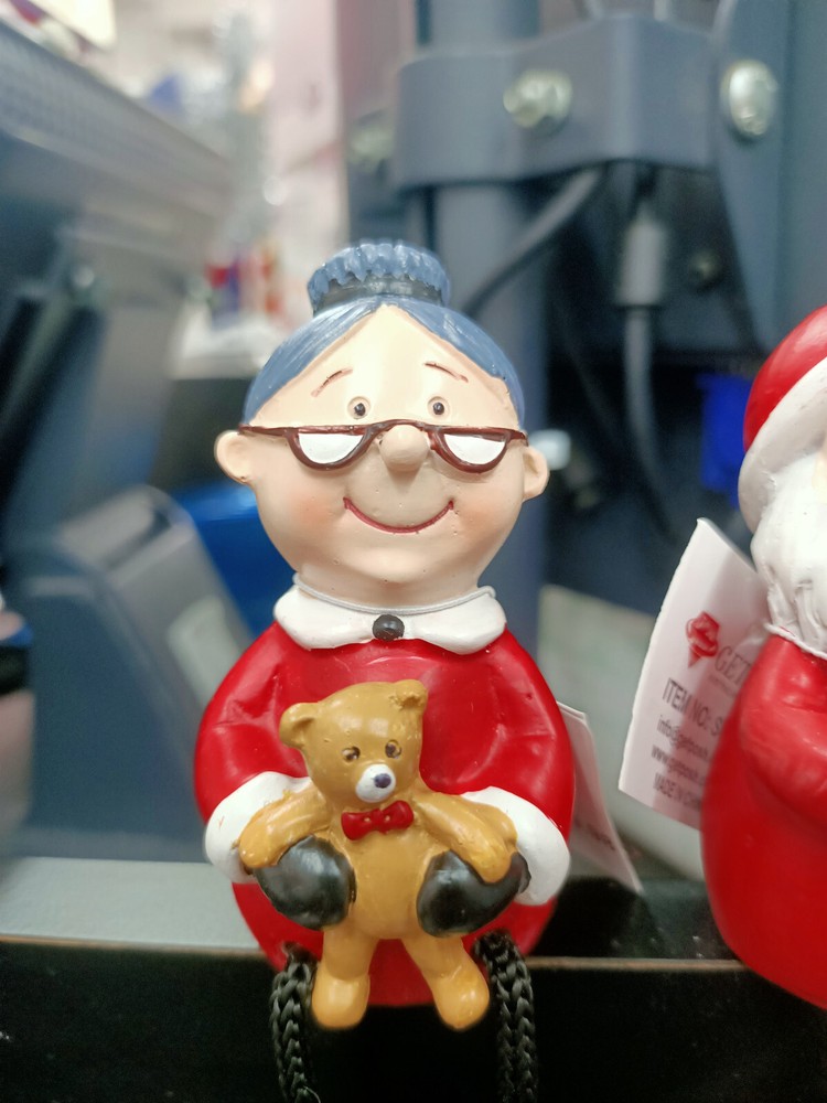 Santa and Mrs Santa sitting figures.