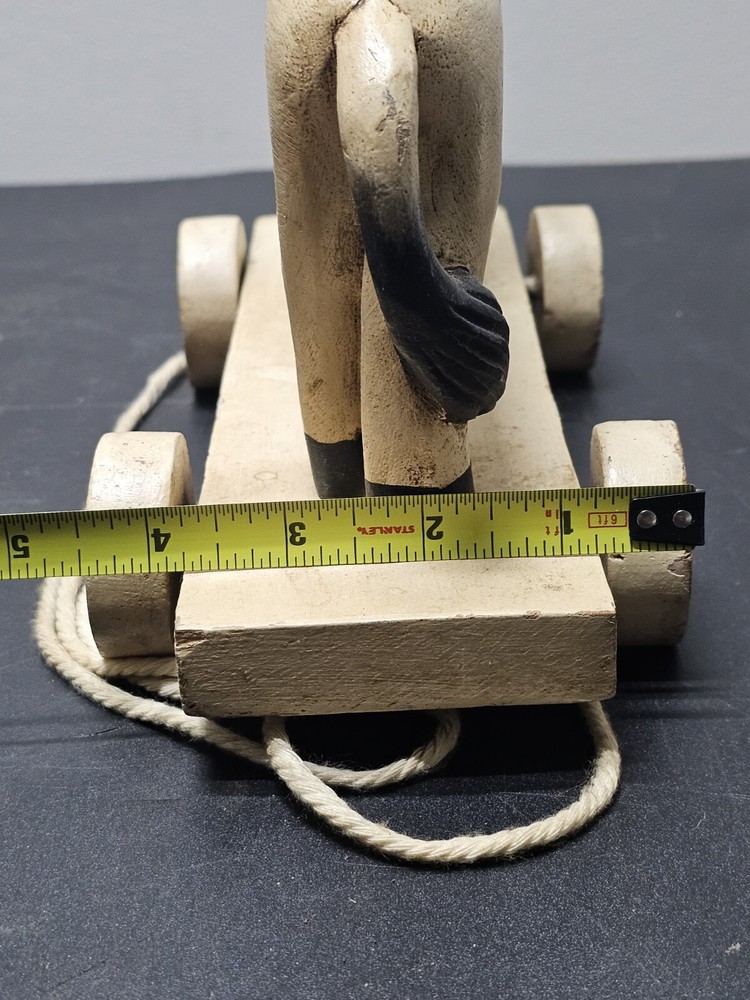 Antique Lion pull toy on wooden platform