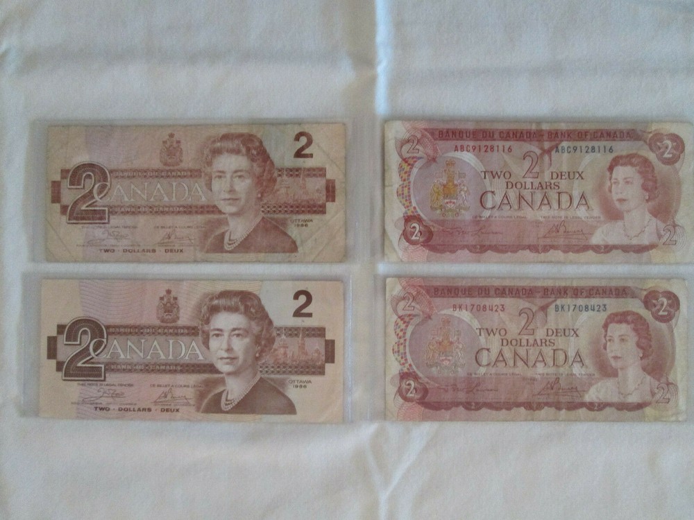 Two dollar Canadian notes plus 2 dollar coin