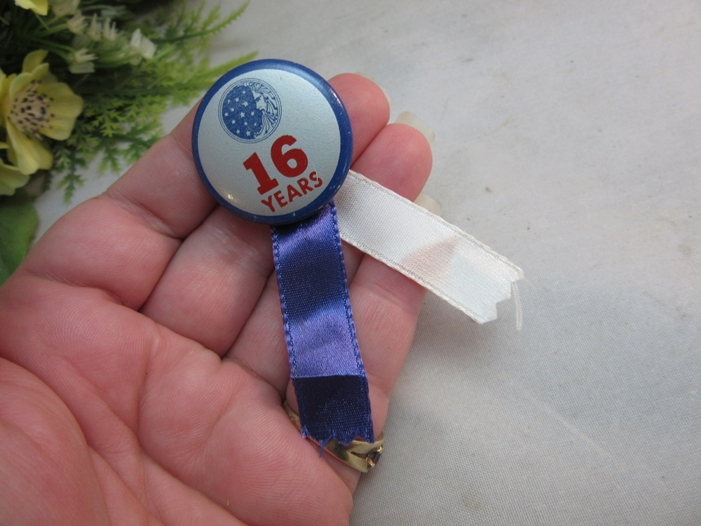 16 years employed by Proctor & Gamble button,ribbon