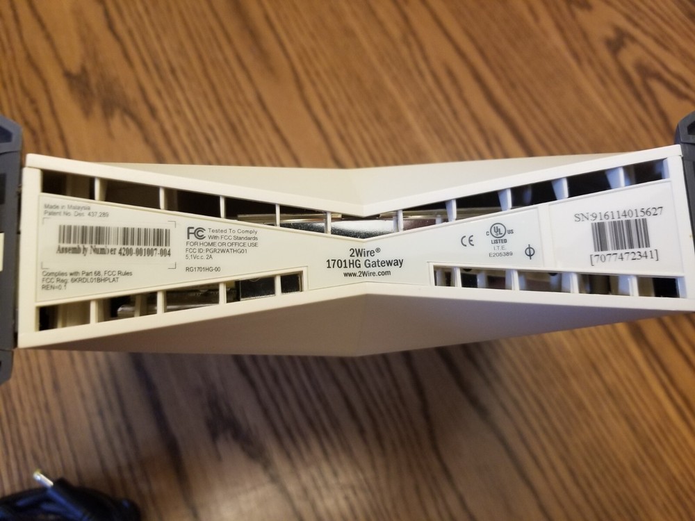 2WIRE 1701HG Gateway with A/C Adapter and DSL filter.