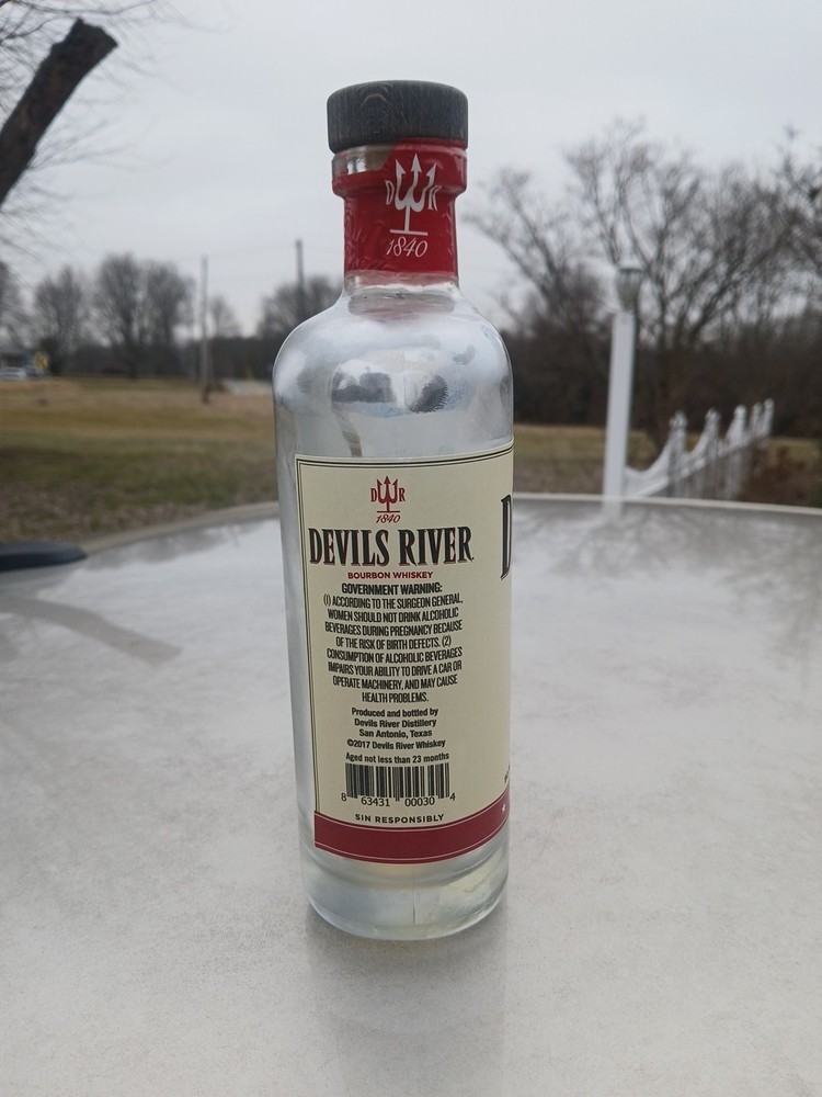 Empty Corked Bottle Of Devil's River Barrel Bourbon Whiskey