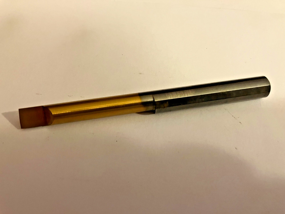 Used Solid Carbide Boring Bar.  3/8" shank . Has been ground off back side a bit