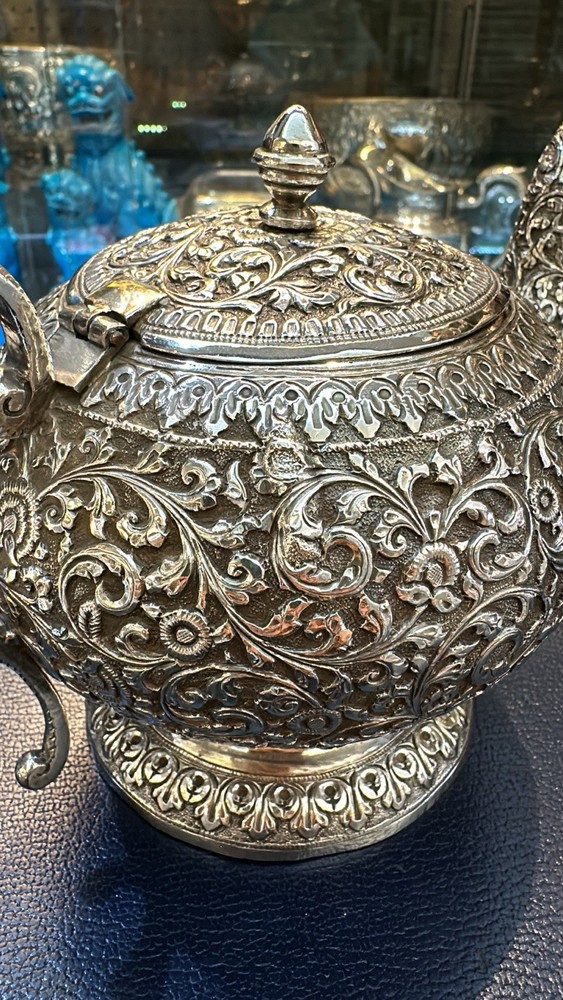 Kutch Indian silver Teapot With Scroll And Rosette Embossing. Circa 1900.