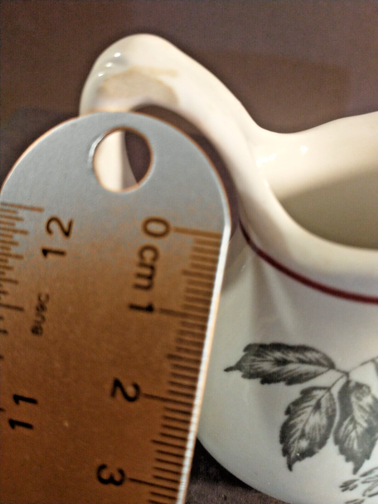 McNicol small creamer with glaze damage on handle