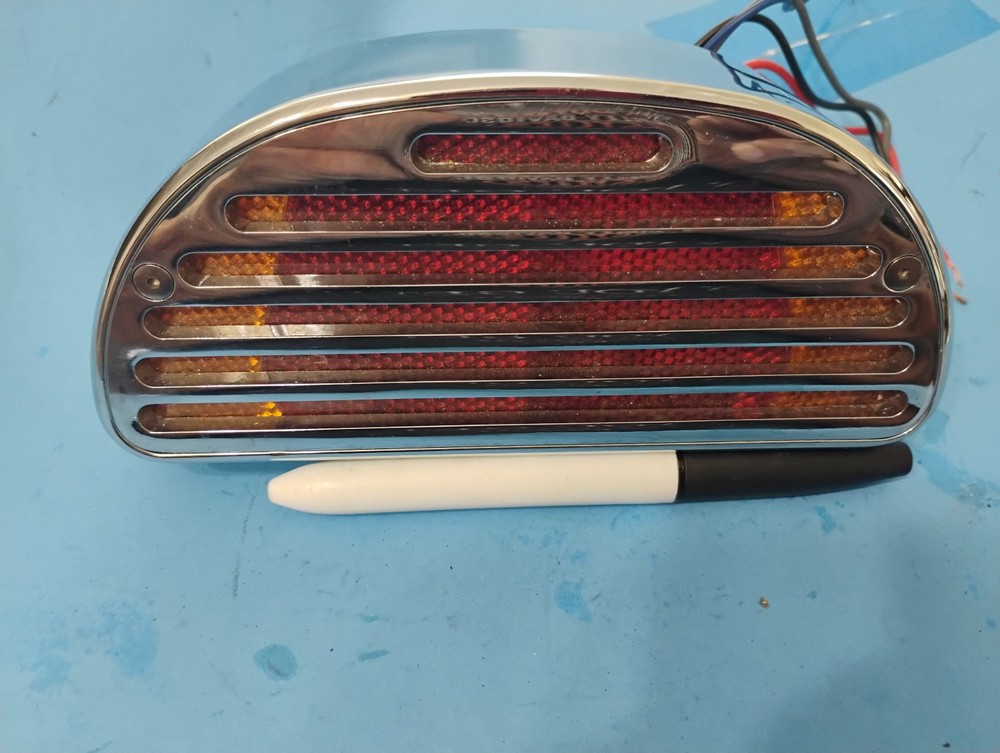 HARLEY NOS CUSTOM BOBTAIL CHROME TAILIGHT WITH DIRECTIONALS IN IT !!!
