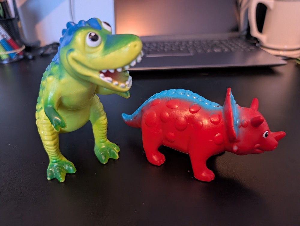 Two Plastic Toy Dinosaurs